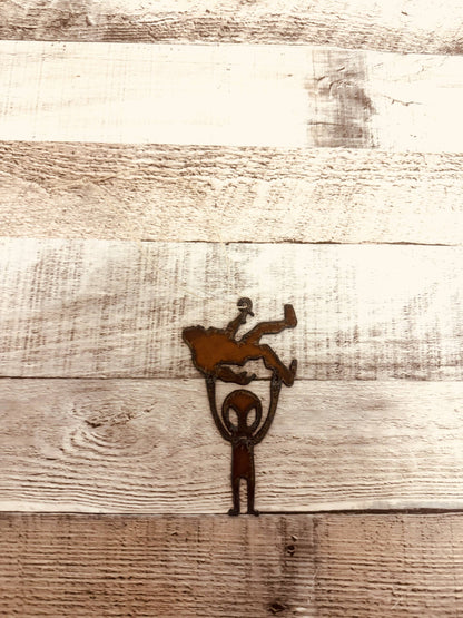 Alien Holding Bigfoot Rustic Metal Ornament